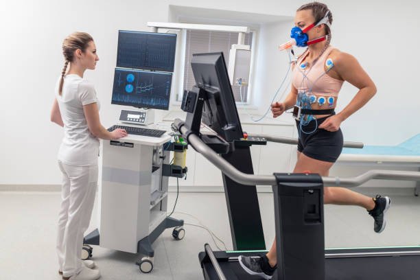 Woman undergoing treadmill stress test (TMT) monitored by a technician, illustrating advanced cardiac diagnostics with Dr. Swapnil Garde best cardiologist in Bhopal.