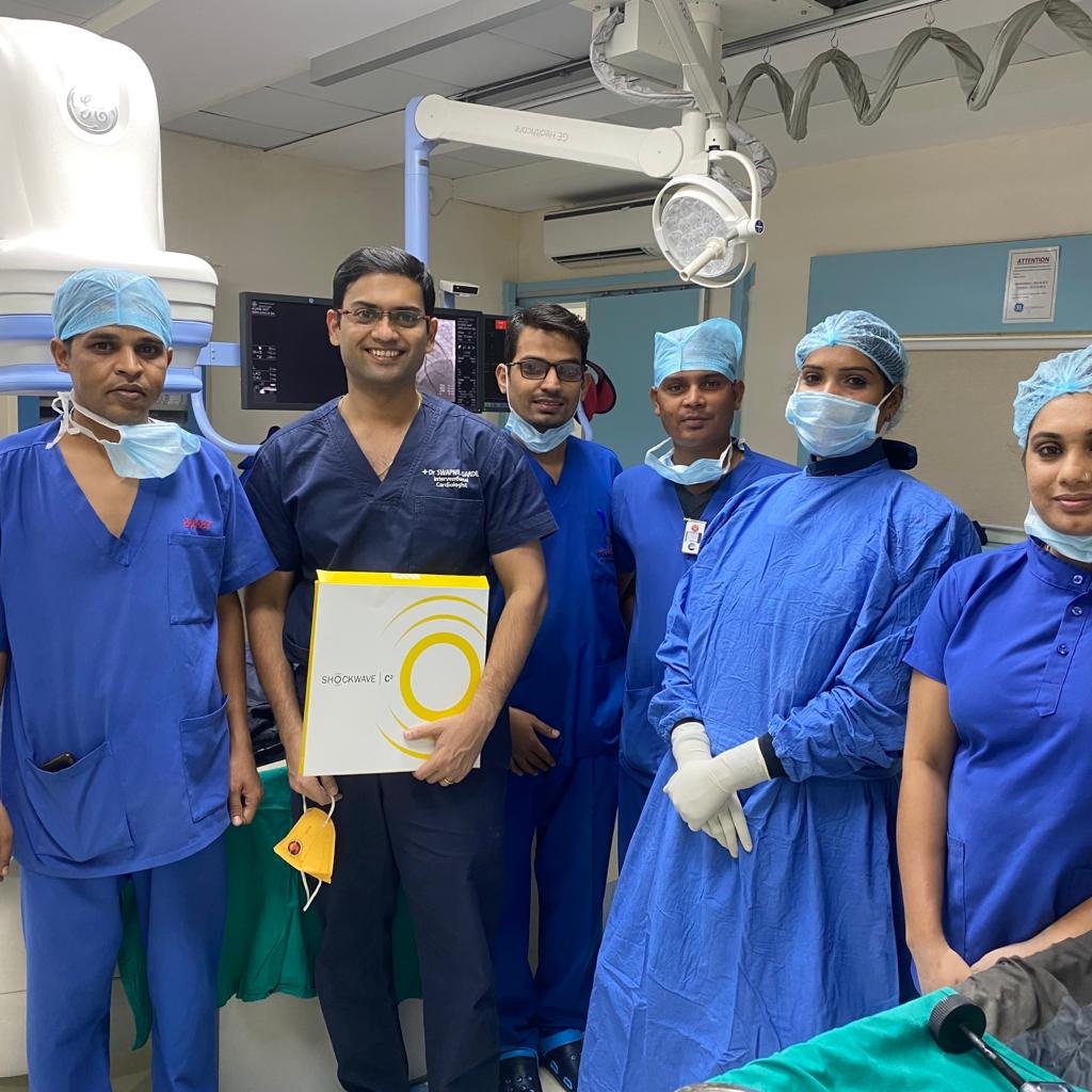 Dr. Swapnil Garde and cath lab staff in Bhopal hospital, representing leading expertise in interventional cardiology procedures and heart care.