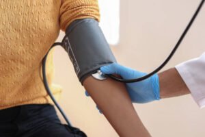 Patient undergoing 24 Hours Blood Pressure Monitoring in Bhopal under the guidance of Dr. Swapnil S. Garde, Best Cardiologist in Bhopal, for accurate hypertension diagnosis.