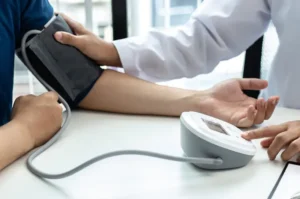 Digital blood pressure monitor used for Ambulatory Blood Pressure Monitoring (ABPM) in Bhopal to diagnose hypertension by Dr. Swapnil S. Garde, Best Cardiologist in Bhopal.