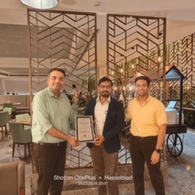 Dr. Swapnil Garde stands with fellow professionals at a formal award ceremony, symbolizing outstanding achievements as the best cardiologist in Bhopal.